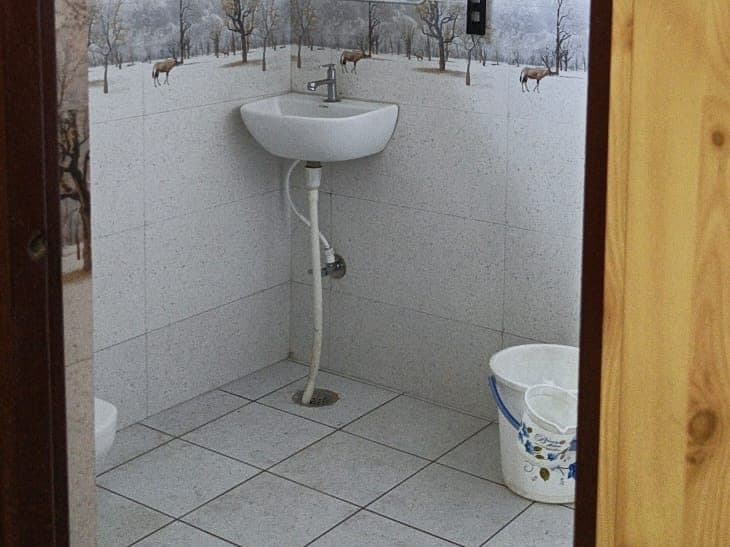 Attached bathroom with shower and wash basin