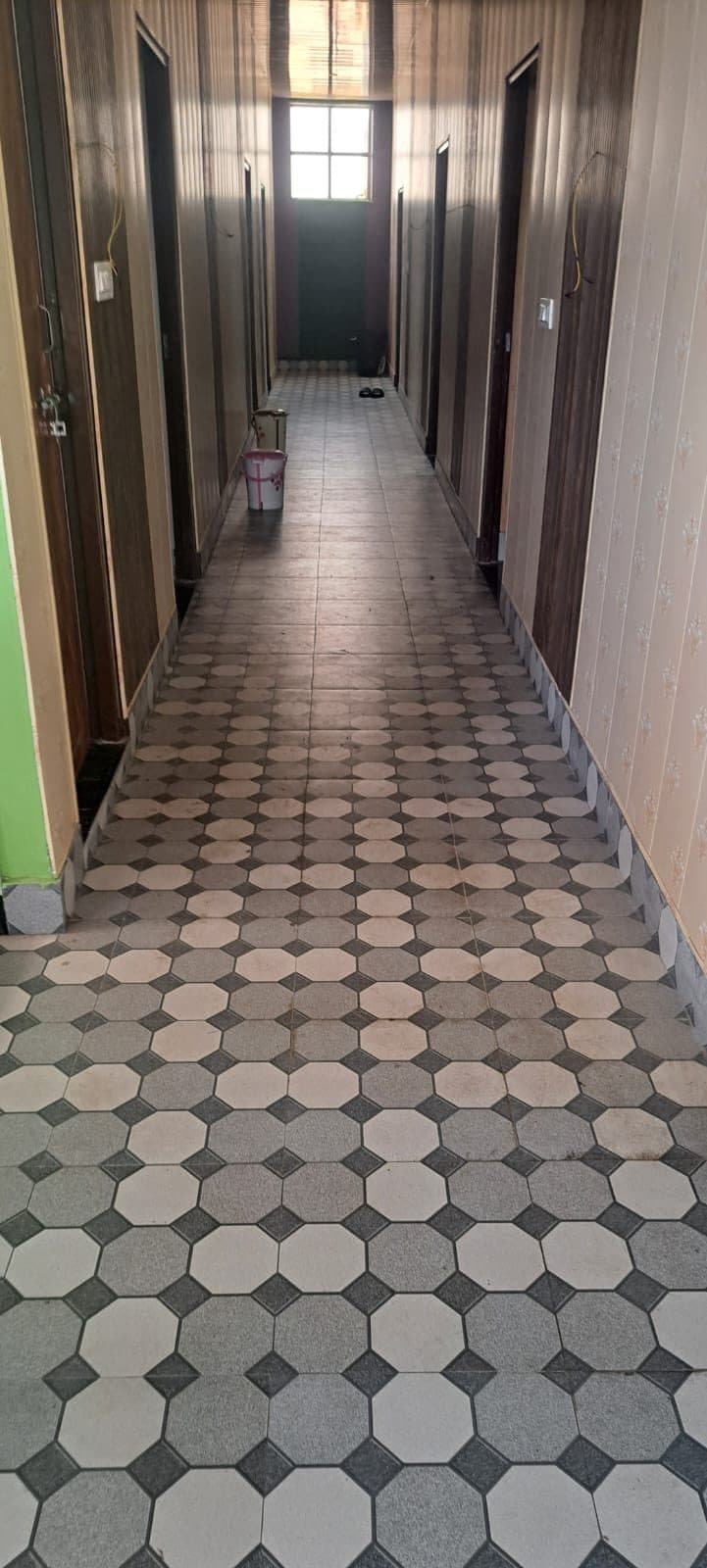 Tiled corridor leading to the guest rooms