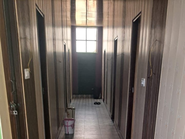 Tiled corridor leading to the guest rooms