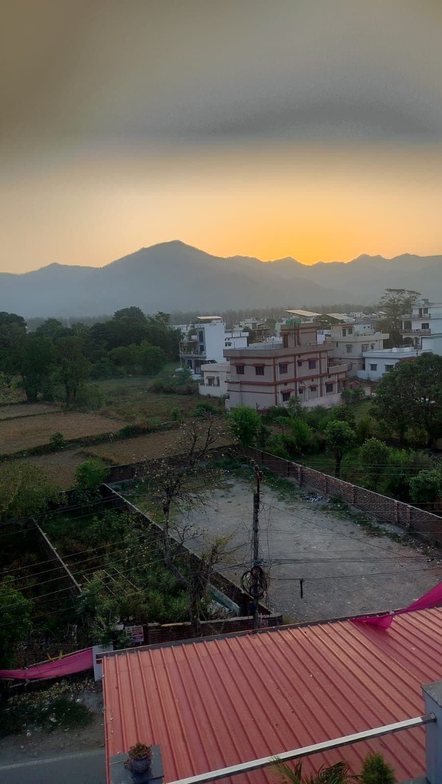View from the terrace across fields to the hills